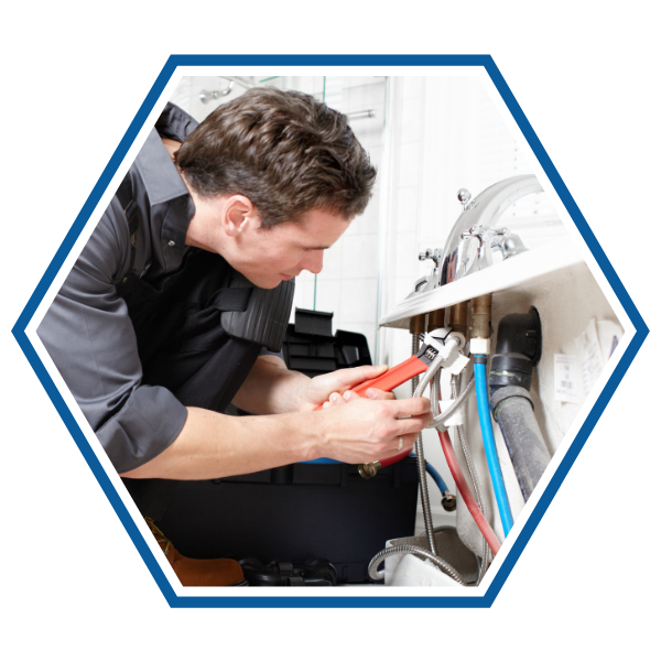 Plumber installing a pipe