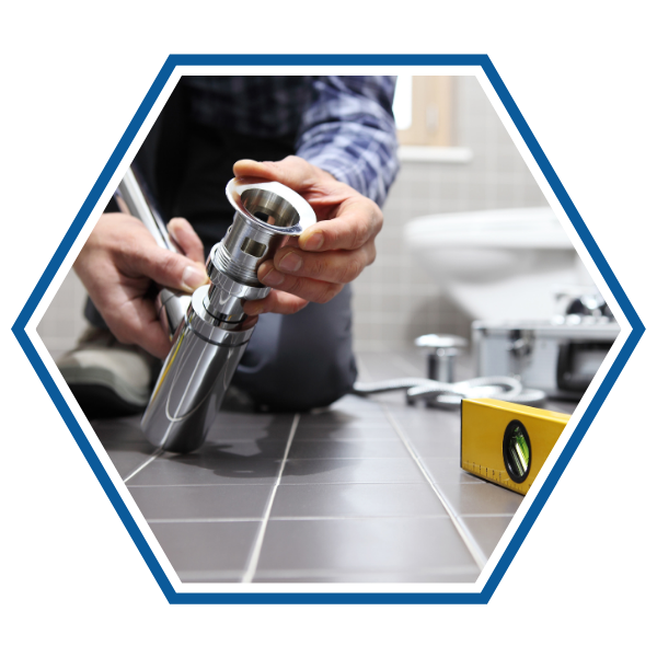 Plumber fixing a pipe