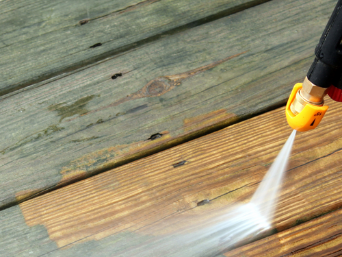 power washing a wooden deck