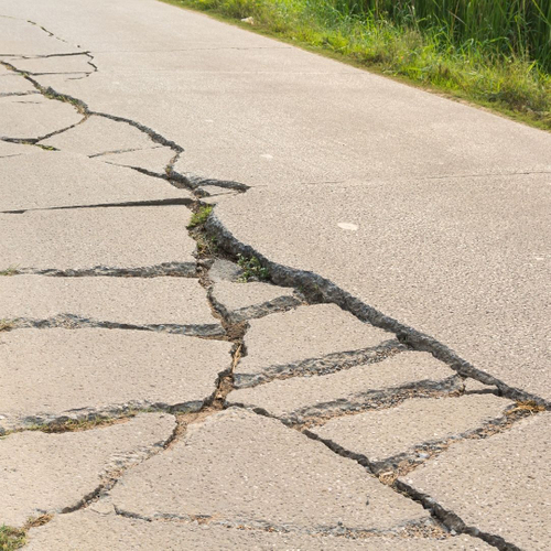 Concrete walkway with major cracking damage