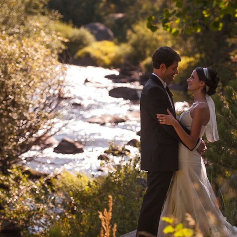 Newlyweds by river