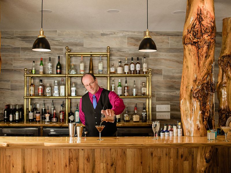 Image of a bartender pouring drinks