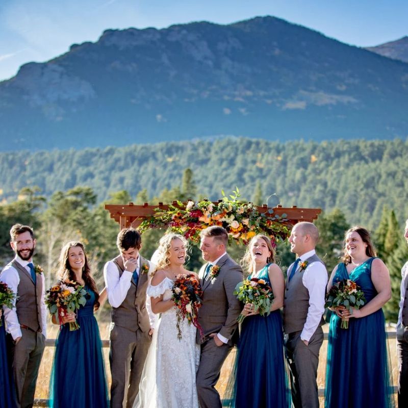 photo of a couple smiling with their bridal party