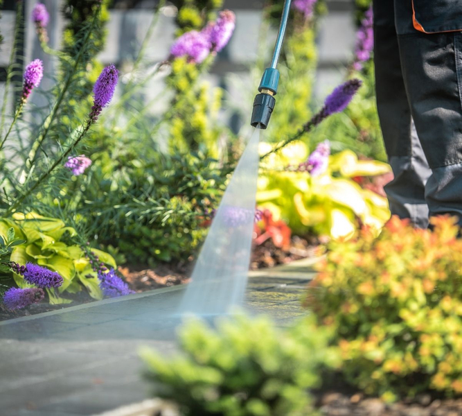 washing walkway with power washer 