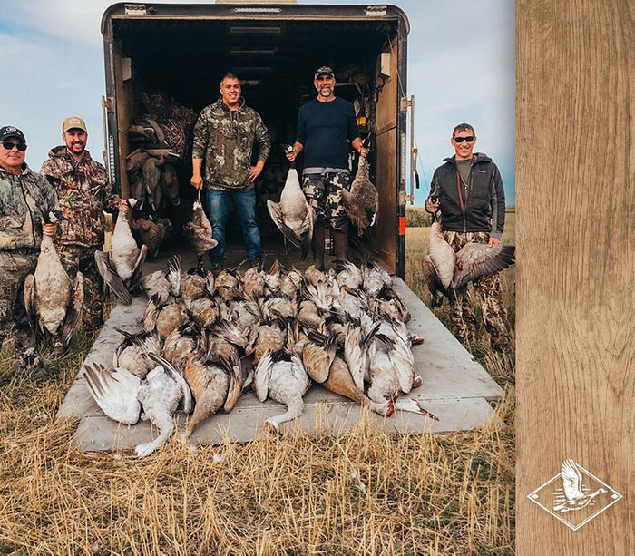 5 hunters with their bounty of waterfowl