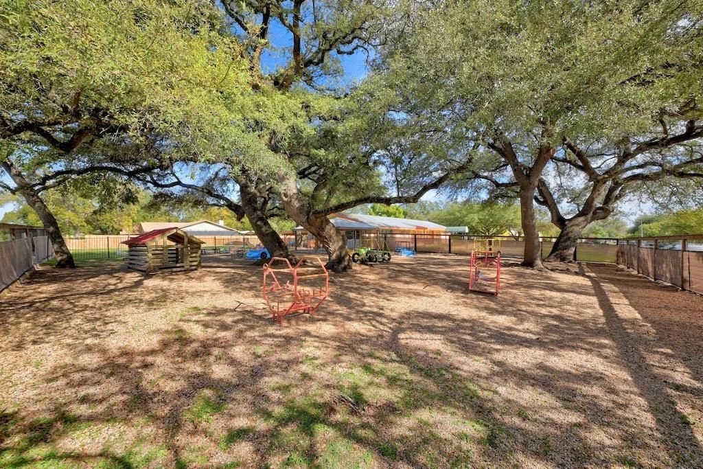 An Oak tree-shaded PreK playground