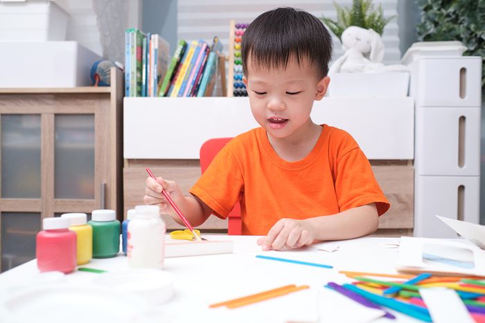 happy toddler painting