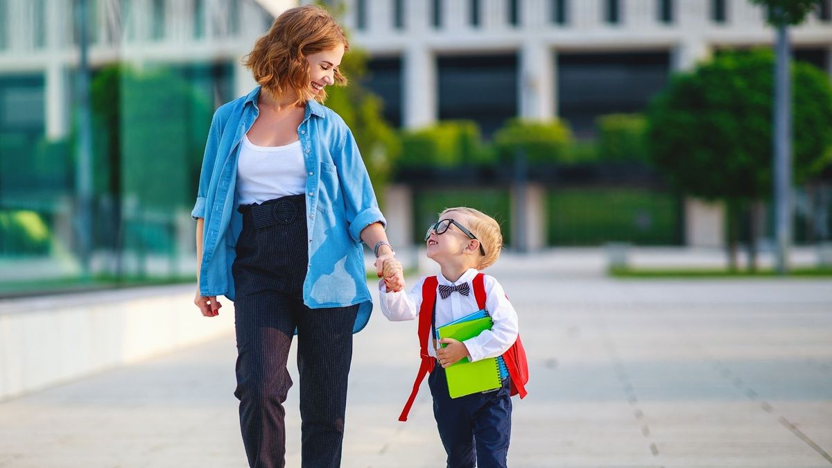 Mother and child walking to school.