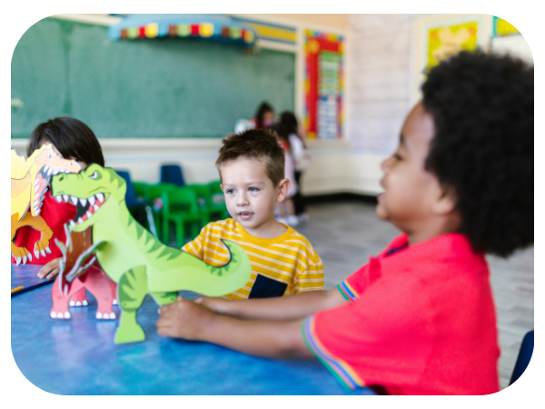 children playing with a toy dinosaur