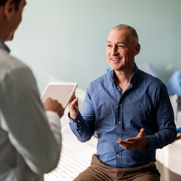 A middle-aged man speaking to his doctor