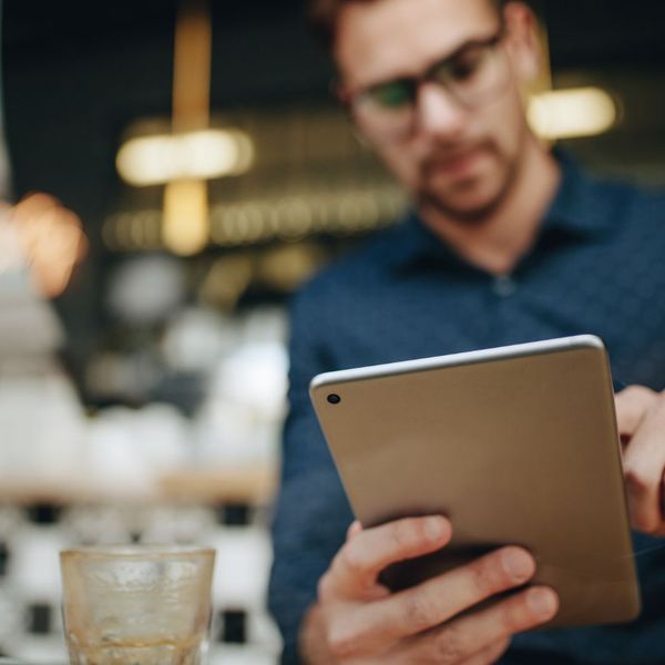 Man looking at a tablet