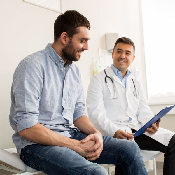 man speaking to doctor