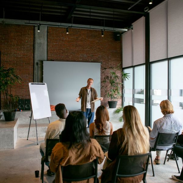a person teaching a class Verifone Certification.jpg