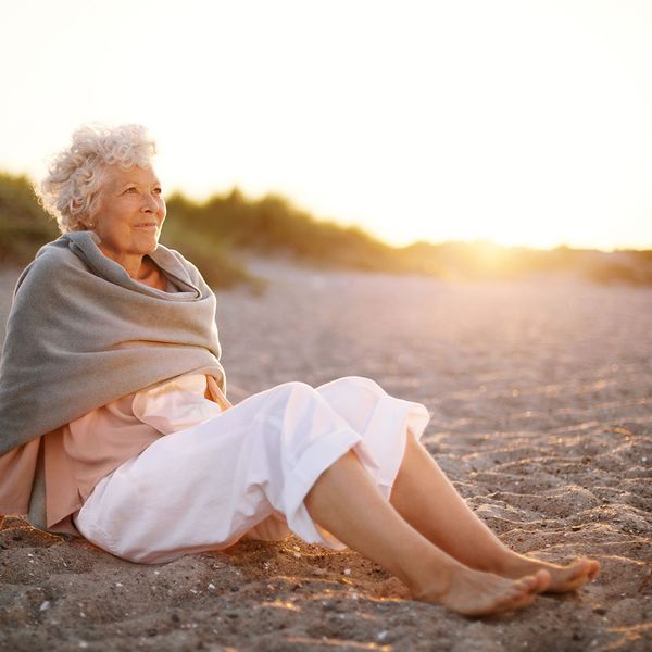 Older woman watching sunset