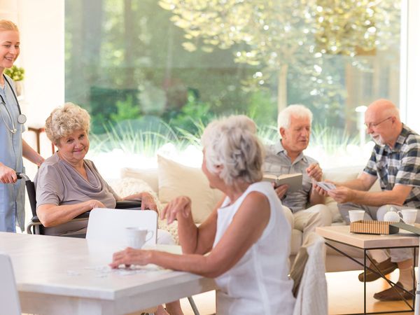 image of group of senior citizens hanging out at an assisted living facility