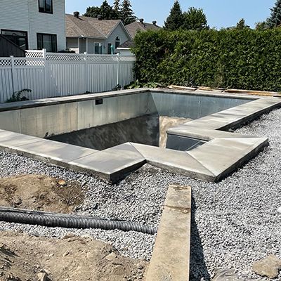 Image of a new concrete pool installation