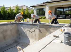 Pool Renovation Team Repairing Concrete Swimming Pool
