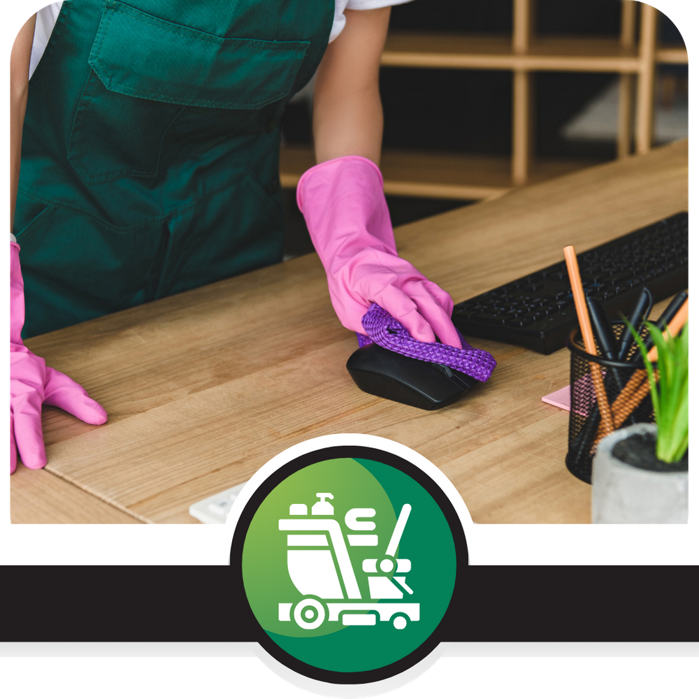 COMMERCIAL OFFICE CLEANING - CTA - Crew member cleaning an office desk