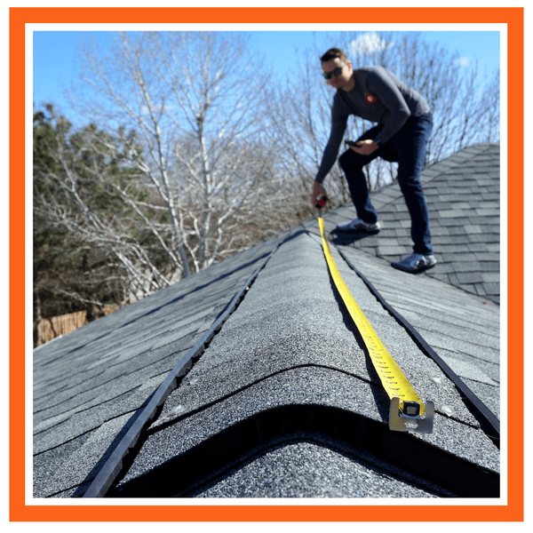 roofer measuring a roof
