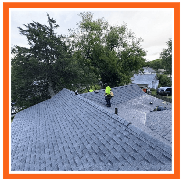 roofer on top of a roof