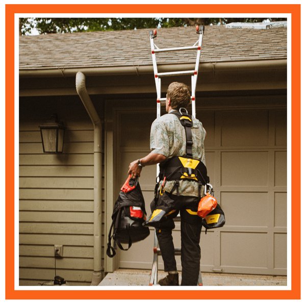 roofer climbing a ladder to the roof