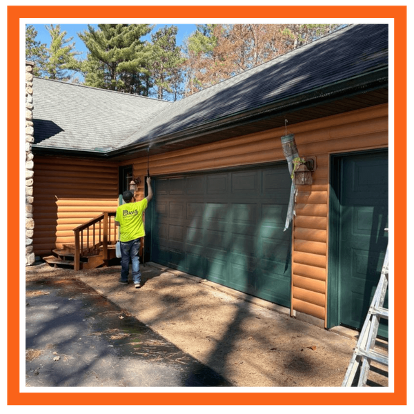 man cleaning gutters