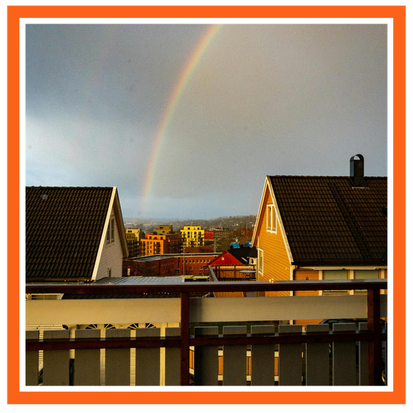rainbow over homes