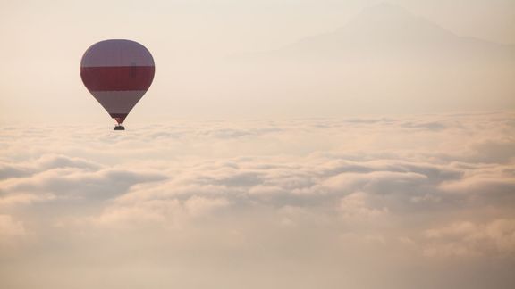 hot air balloon high in the clouds