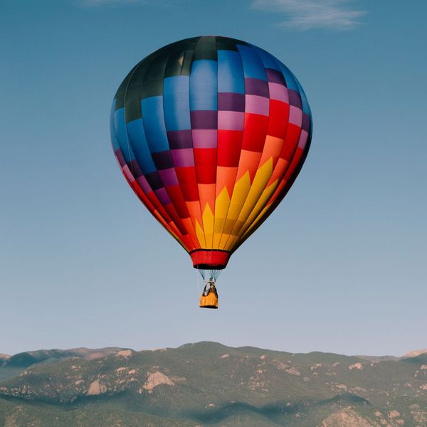 Hot air balloon over a mountain range