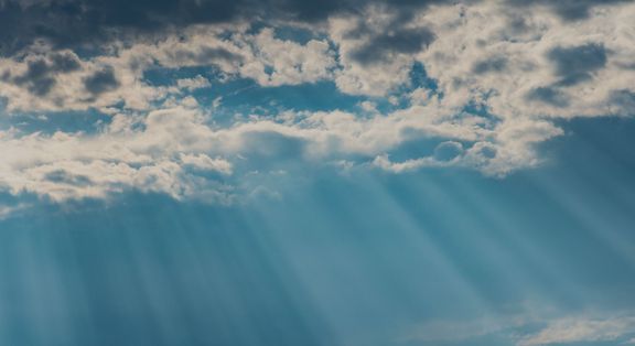 sun rays through the clouds