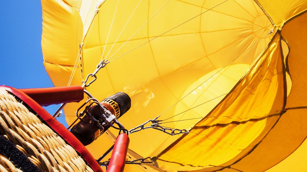 Low-angle view of a yellow hot air balloon