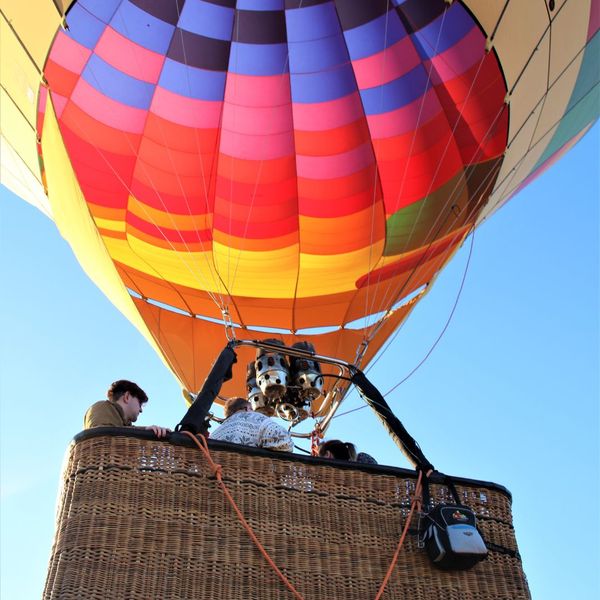 people in a hot air balloon basket