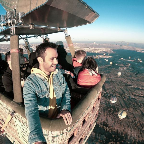 man taking a selfie in a hot air balloon