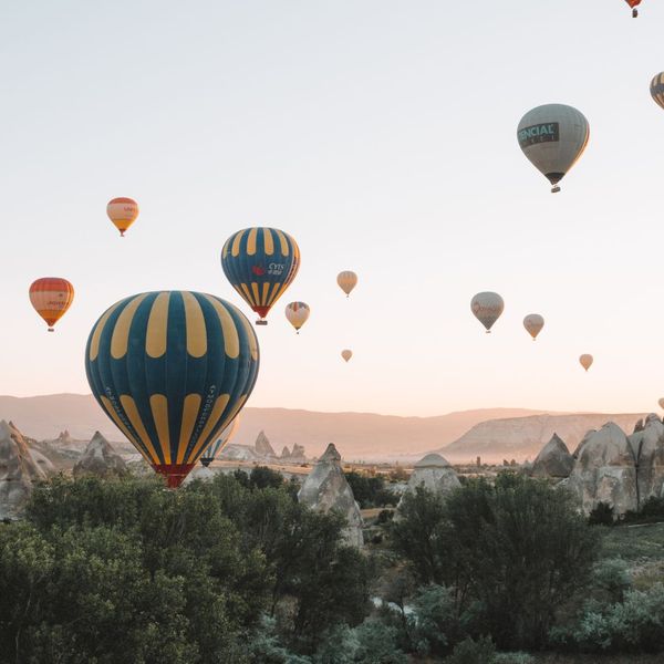 A variety of hot air balloons flying