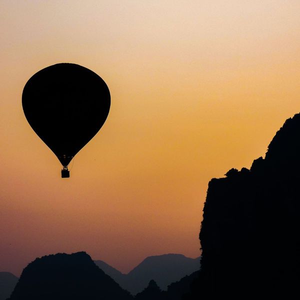 Silhouette of hot air balloon in the sky at sunset 
