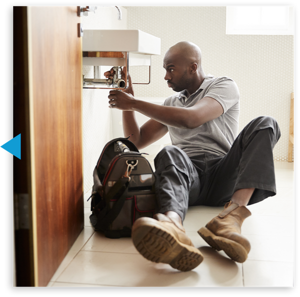 Plumber working on a sink