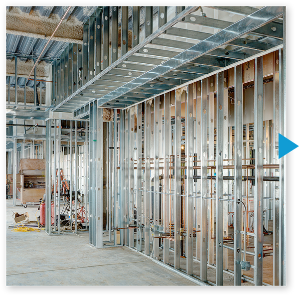 Metal framing and pipes in renovated commercial space