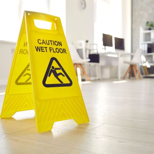 Caution Wet Floor sign in office