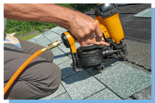 nailing new shingles on roof