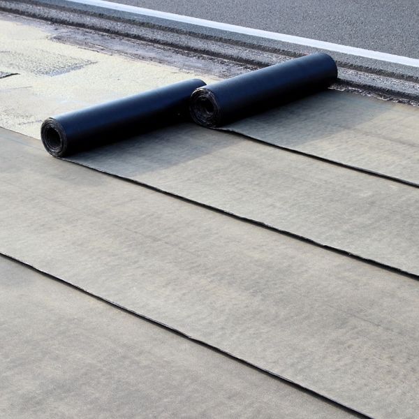 rolling out underlayment on a roof