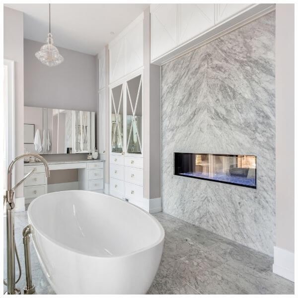 bathroom with free-standing tub and fireplace