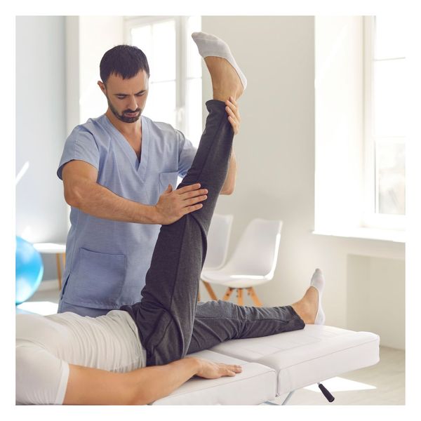 chiropractor working with patient