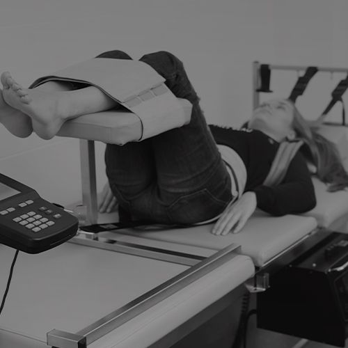 a person laying in a chiropractic machine