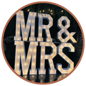 Marquee signs that read "MR & MRS"