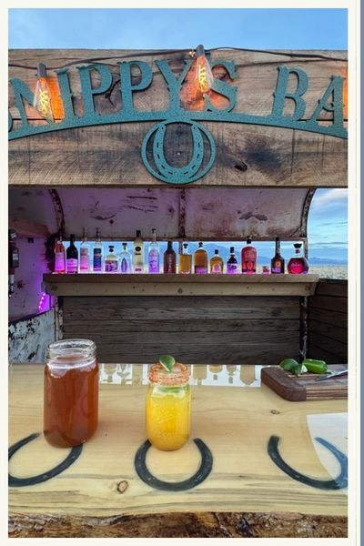 Close up of mason jars on counter top of mobile bar