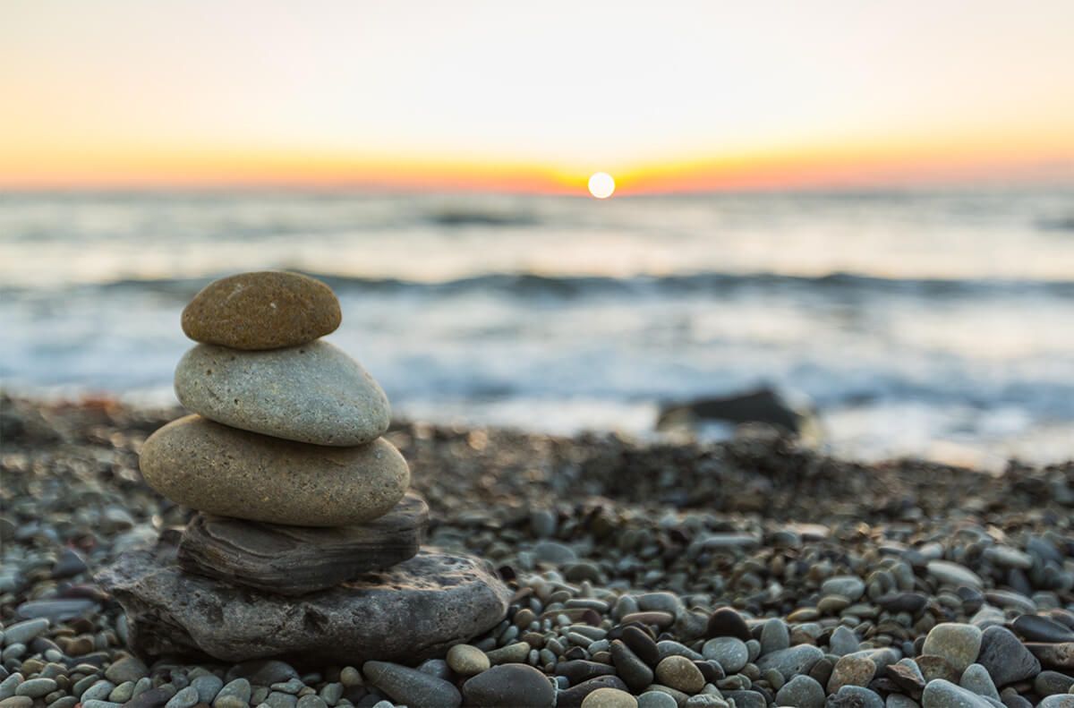 stacked smooth rocks on the beach