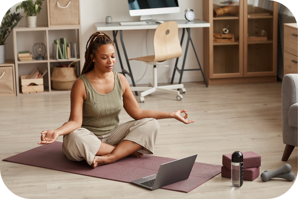 woman practicing yoga on wellness journey