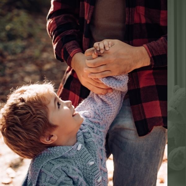 toddler holding father's hand