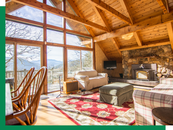 red area rug inside of beautiful cabin