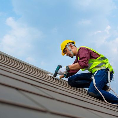 Man working on a roof Man working on a roof